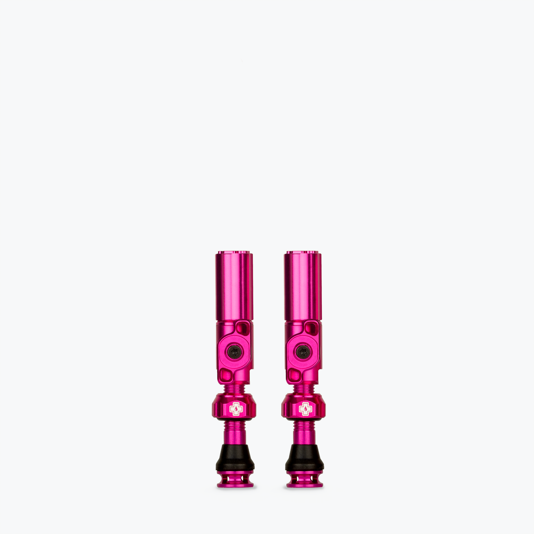 Muc-Off Big Bore Hybrid Tubeless Presta Valves in pink anodized aluminum finish