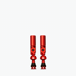 Two red Muc-Off Big Bore Hybrid Tubeless Presta Valves on white background