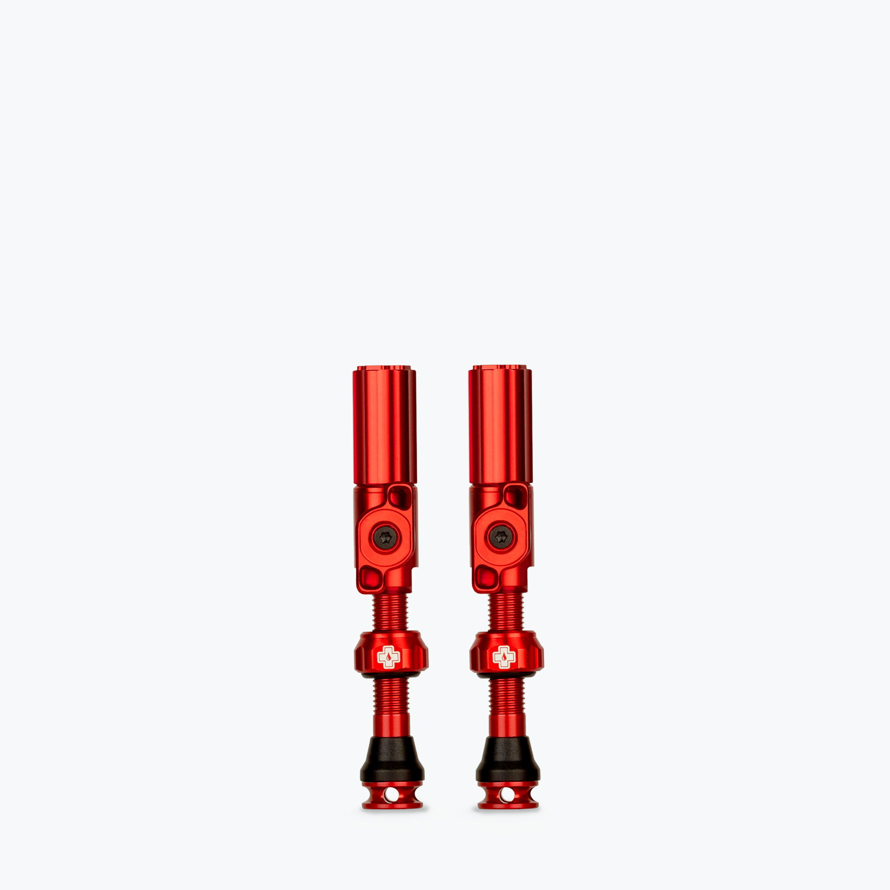 Pair of red Muc-Off Big Bore Hybrid Tubeless Presta Valves with threaded stems