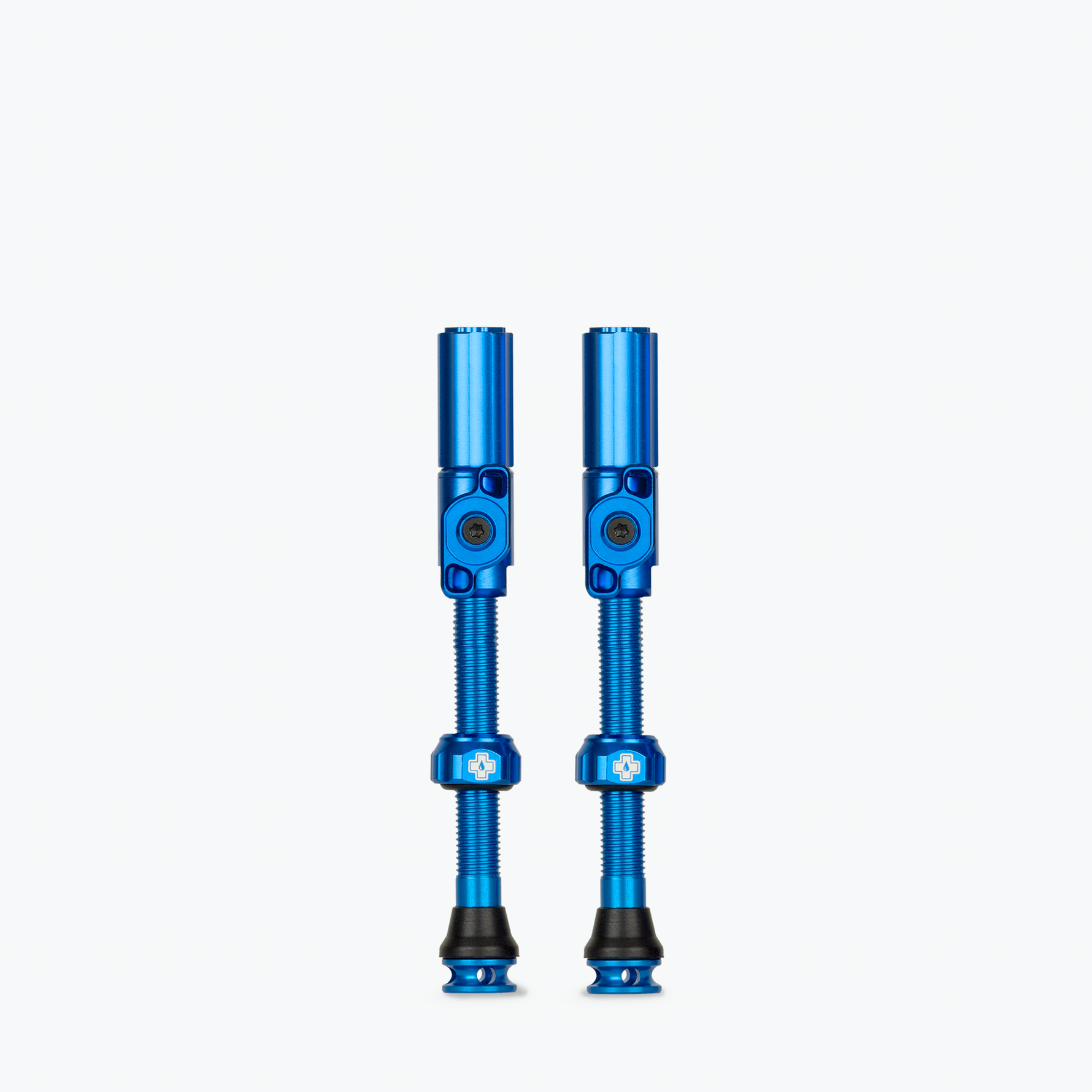 Two blue Muc-Off Big Bore Hybrid Tubeless Presta Valves on white background