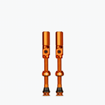 Pair of orange anodized Muc-Off Big Bore Hybrid Tubeless Presta valves