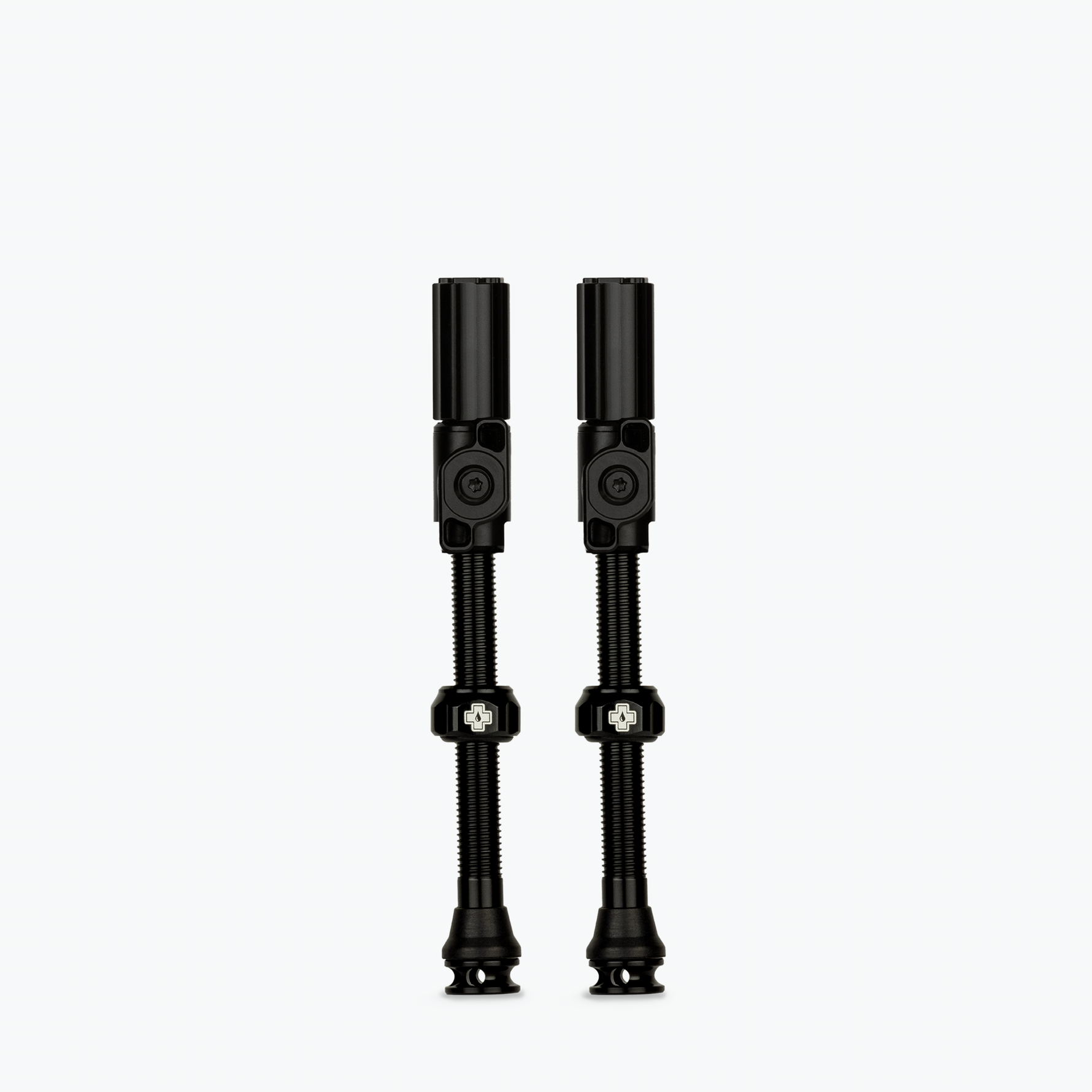 Two black Muc-Off Big Bore Hybrid Tubeless Presta Valves on white background