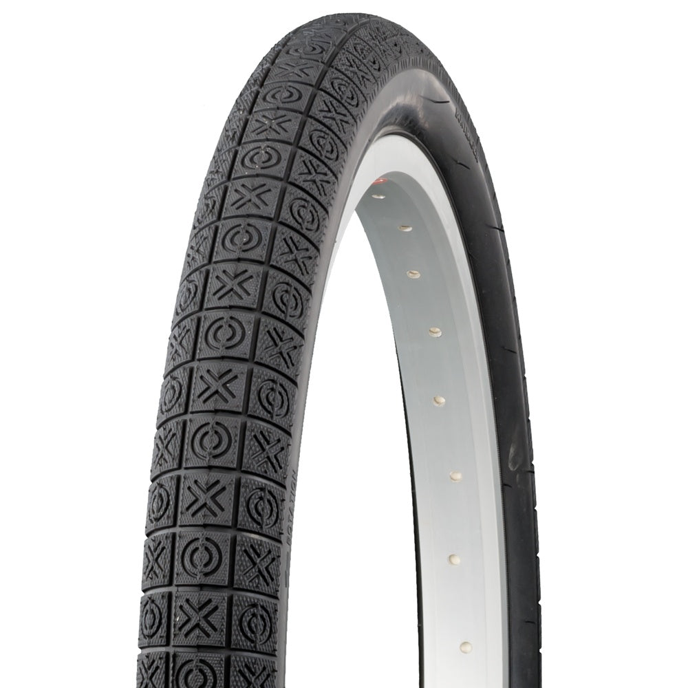 Bontrager Dialed 12x1.75 black BMX tire with XO tread pattern on white rim