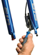 Park Tool PP-1.2 hydraulic disc brake piston press tool in blue being held by hand