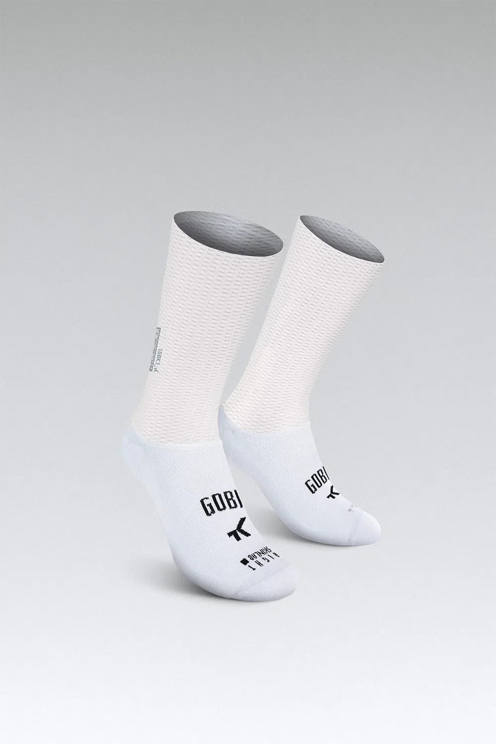 Gobik Vortex 2.0 white cycling socks with textured pattern on gray background