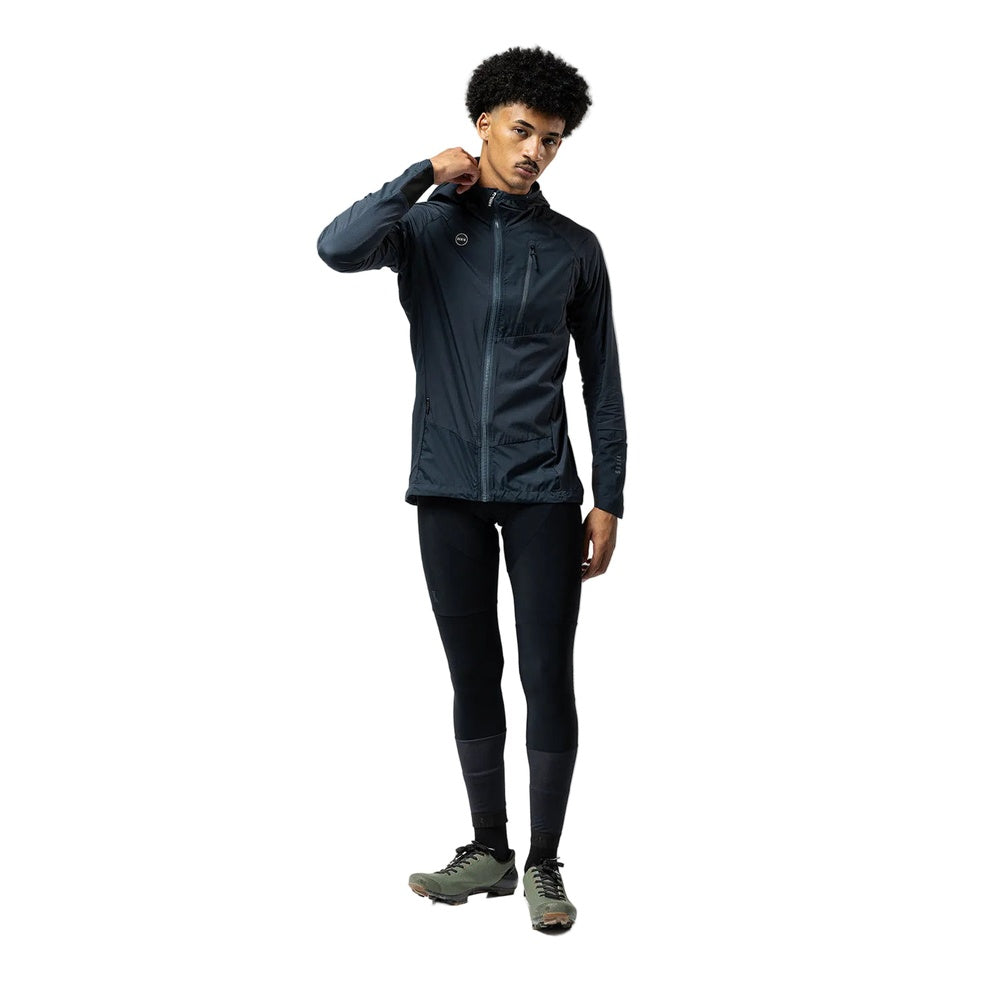 Man wearing Gobik lightweight rain jacket in petrol blue with hood and full zip