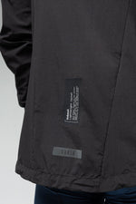 Gobik Unbeat lightweight rain jacket detail showing brand labels and fabric texture