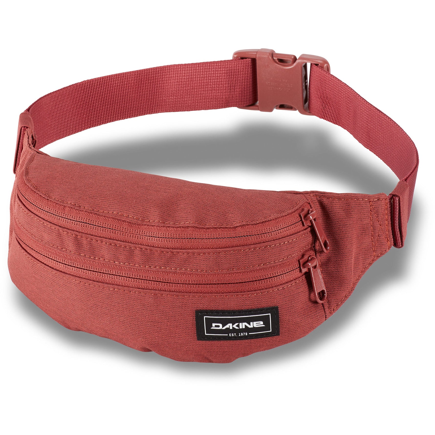 Red Dakine hip pack waist bag with multiple zippered compartments and adjustable strap