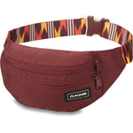 Dakine burgundy hip pack with geometric patterned waist strap and zip pocket