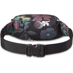 Dakine hip pack with black background and colorful tropical floral print pattern