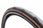 Continental Grand Prix 5000 bicycle tire with black tread and tan sidewall