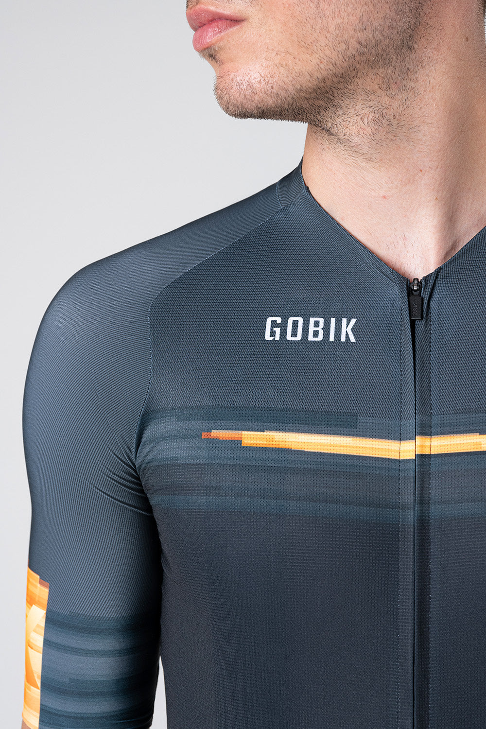 Gobik CX Pro cycling jersey in dark gray with orange accent stripes