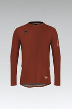 Gobik Terrain long sleeve cycling shirt in rooibos red-brown color with yellow accents