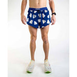 Man wearing blue ChicknLegs running shorts with white diamond pattern and drawstring waist