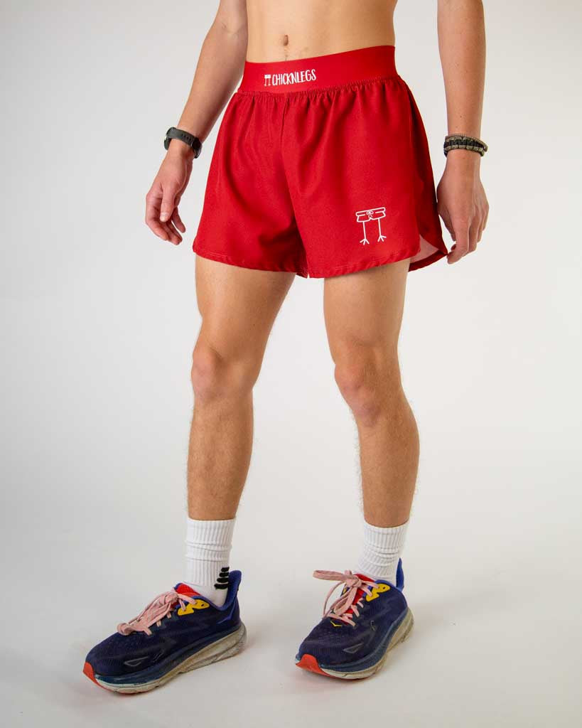 ChicknLegs 2-inch DS Split Shorts in Cardinal Red worn by male runner with running shoes
