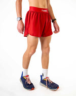ChicknLegs 2-inch DS Split Shorts in Cardinal Red worn by male model with running shoes