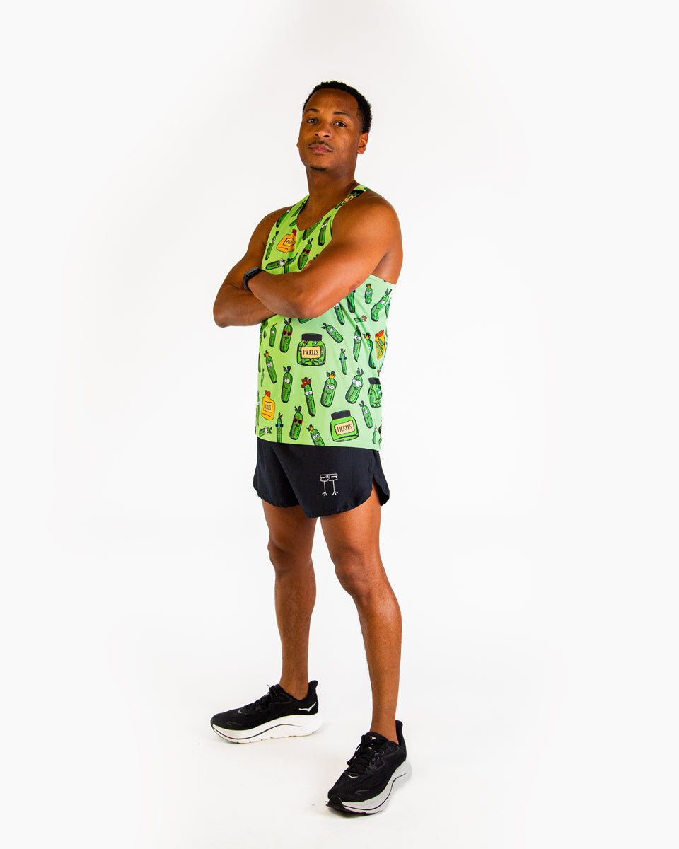 Man wearing bright green ChicknLegs performance singlet with colorful pickle pattern design