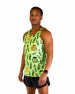 Man wearing light green ChicknLegs singlet with colorful pickle jar pattern
