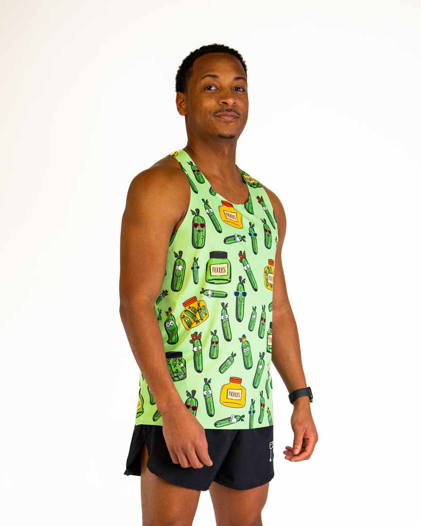 Man wearing light green running singlet with pickle and condiment pattern design