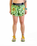 Woman wearing ChicknLegs green pickle print 4 inch split running shorts