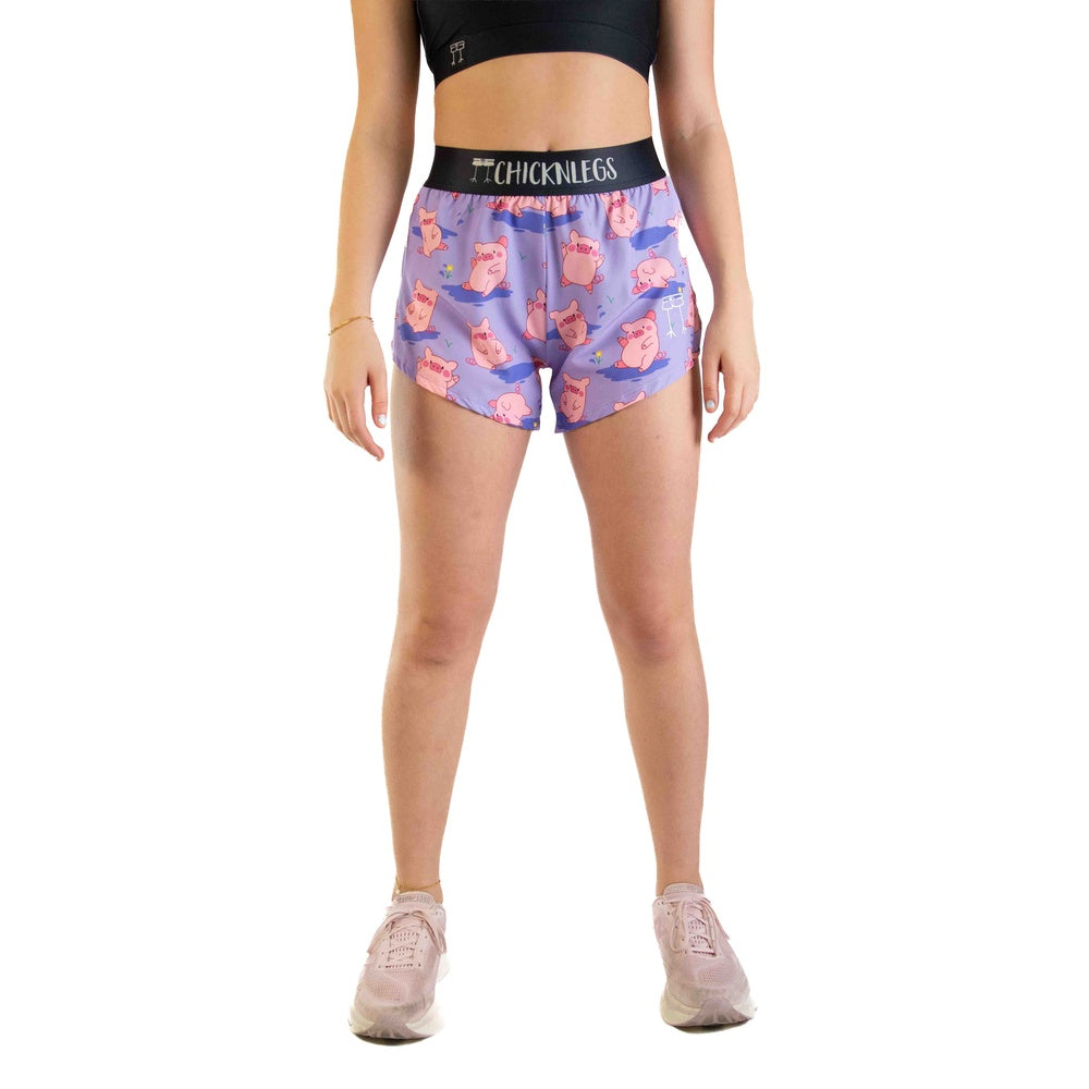 ChicknLegs women's purple split shorts with pink pig pattern and black waistband