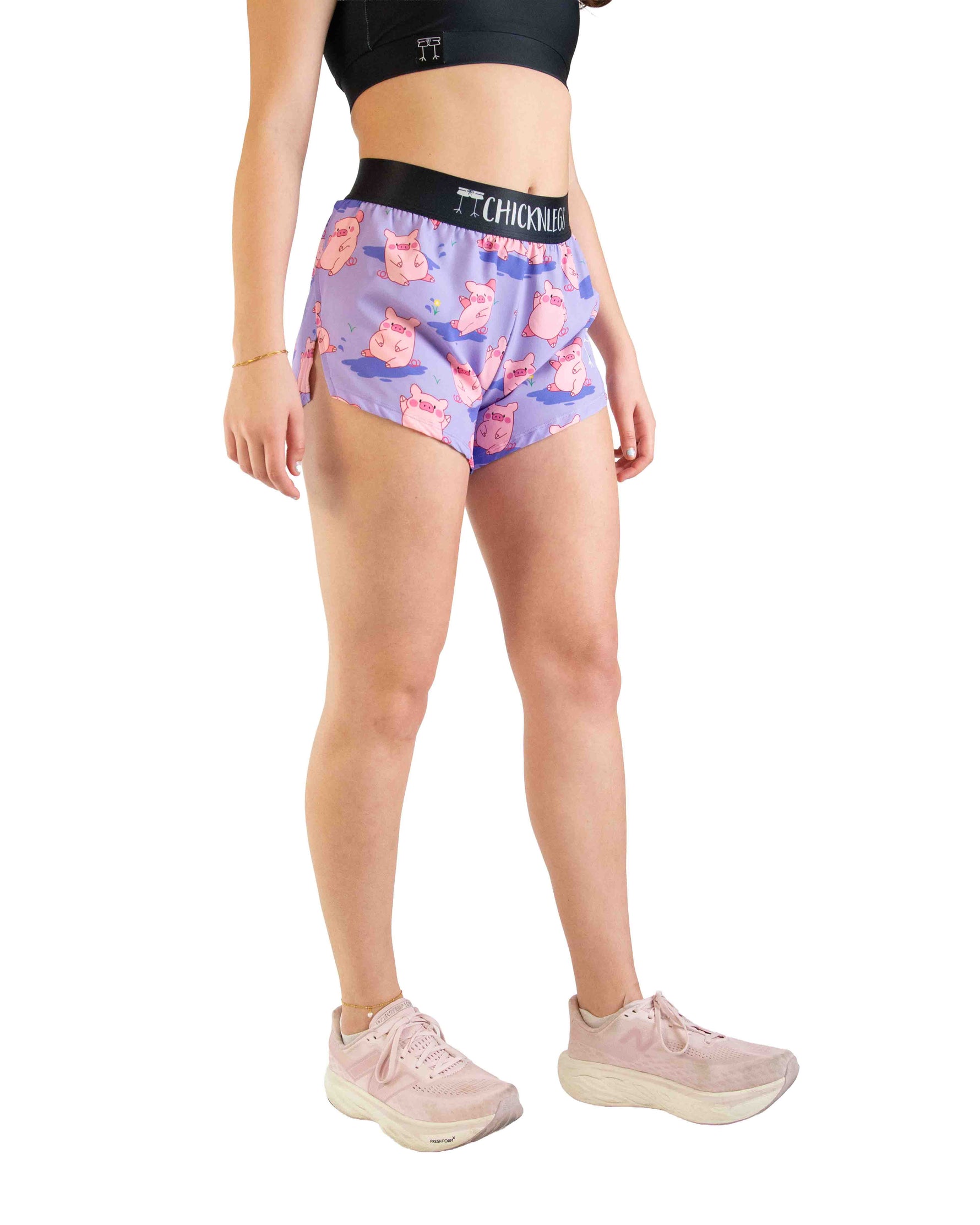 ChicknLegs women's purple split shorts with pink pig pattern and black waistband