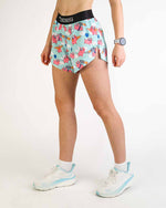 Woman wearing ChicknLegs mint green split shorts with pink pig pattern and black waistband