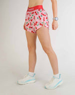 ChicknLegs 4-inch split running shorts in pink cherry print with red waistband