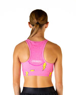Back view of woman wearing pink ChicknLegs sports bra with lightning bolt pattern