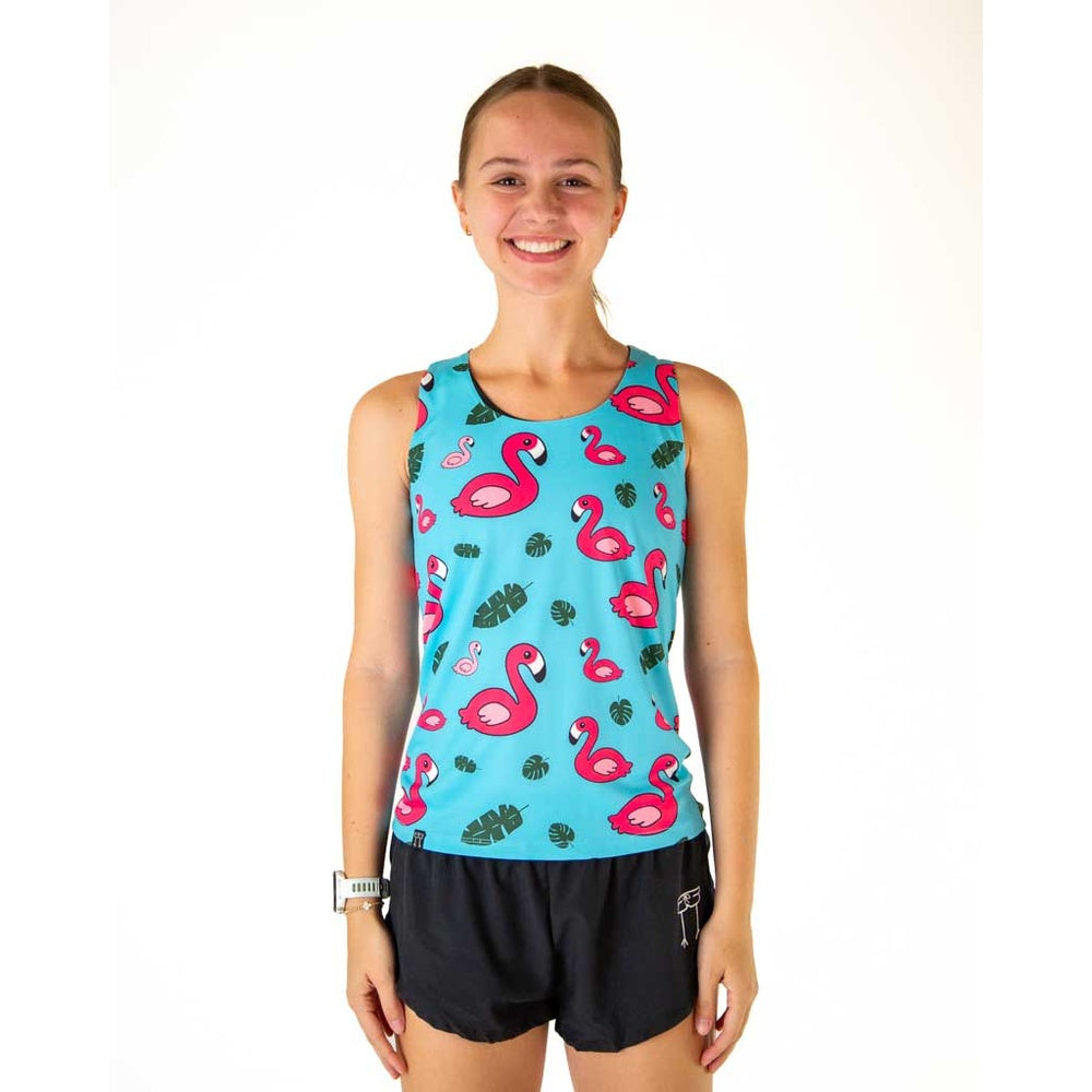 Woman wearing turquoise blue athletic tank top with pink flamingo pattern and black shorts