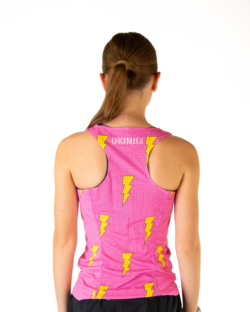 Back view of woman wearing pink ChicknLegs performance singlet with yellow lightning bolts