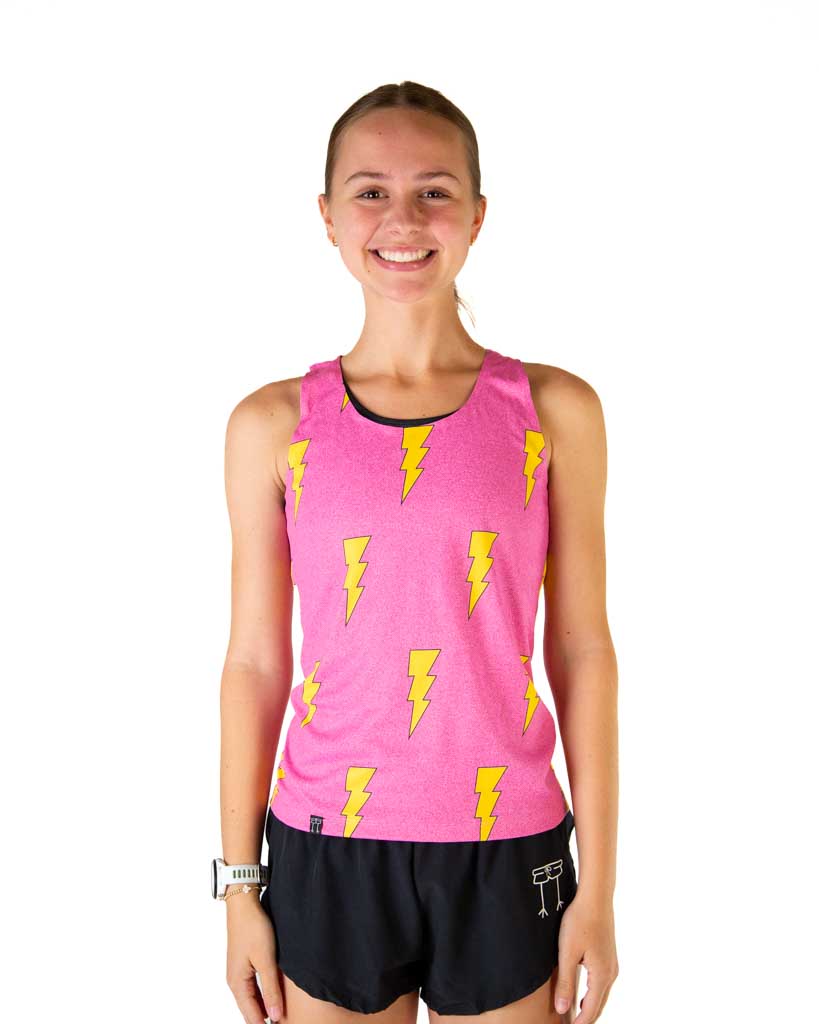 Woman wearing pink athletic singlet with yellow lightning bolt pattern