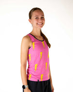 Woman wearing pink athletic tank top with yellow lightning bolt pattern