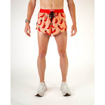 ChicknLegs men's running shorts with red chili pepper pattern on coral background