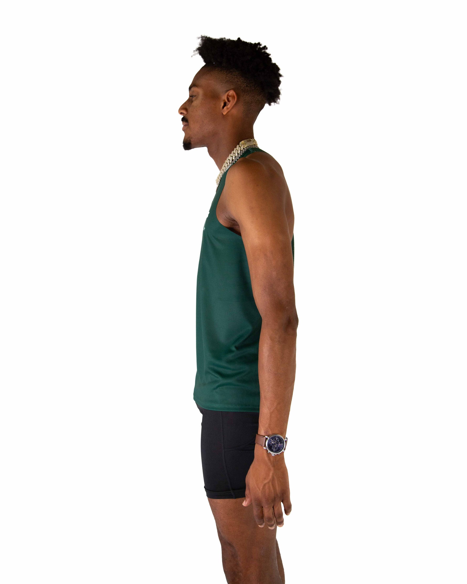 Man wearing forest green performance singlet tank top in profile view