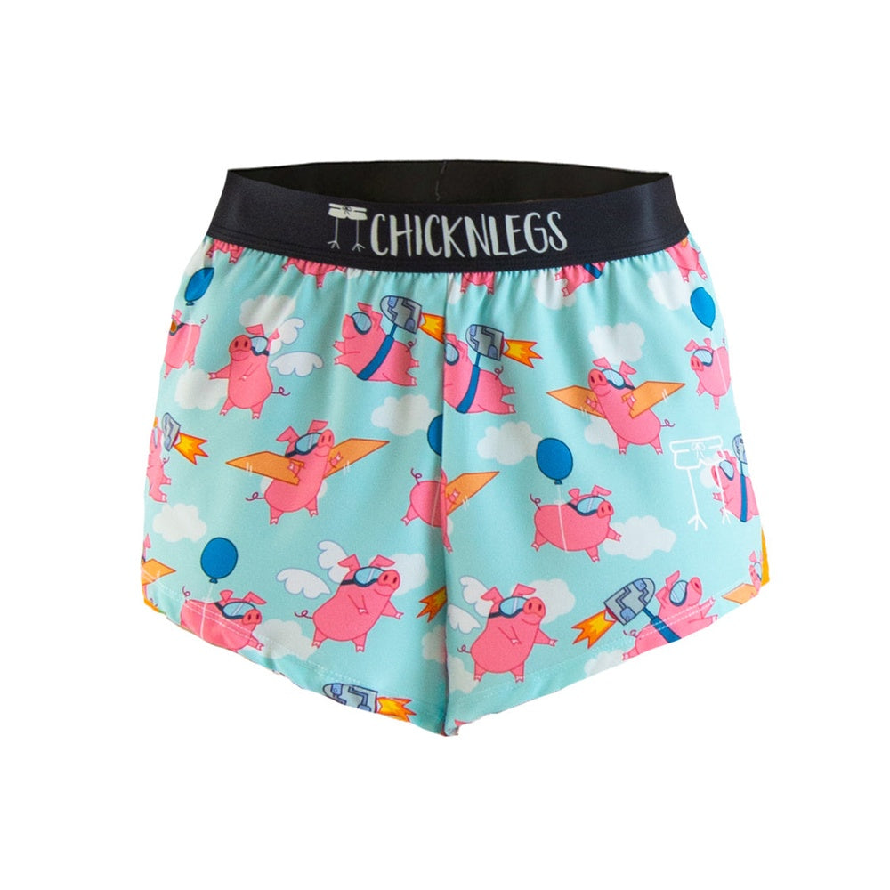 ChicknLegs men's running shorts with flying pigs pattern on light blue background