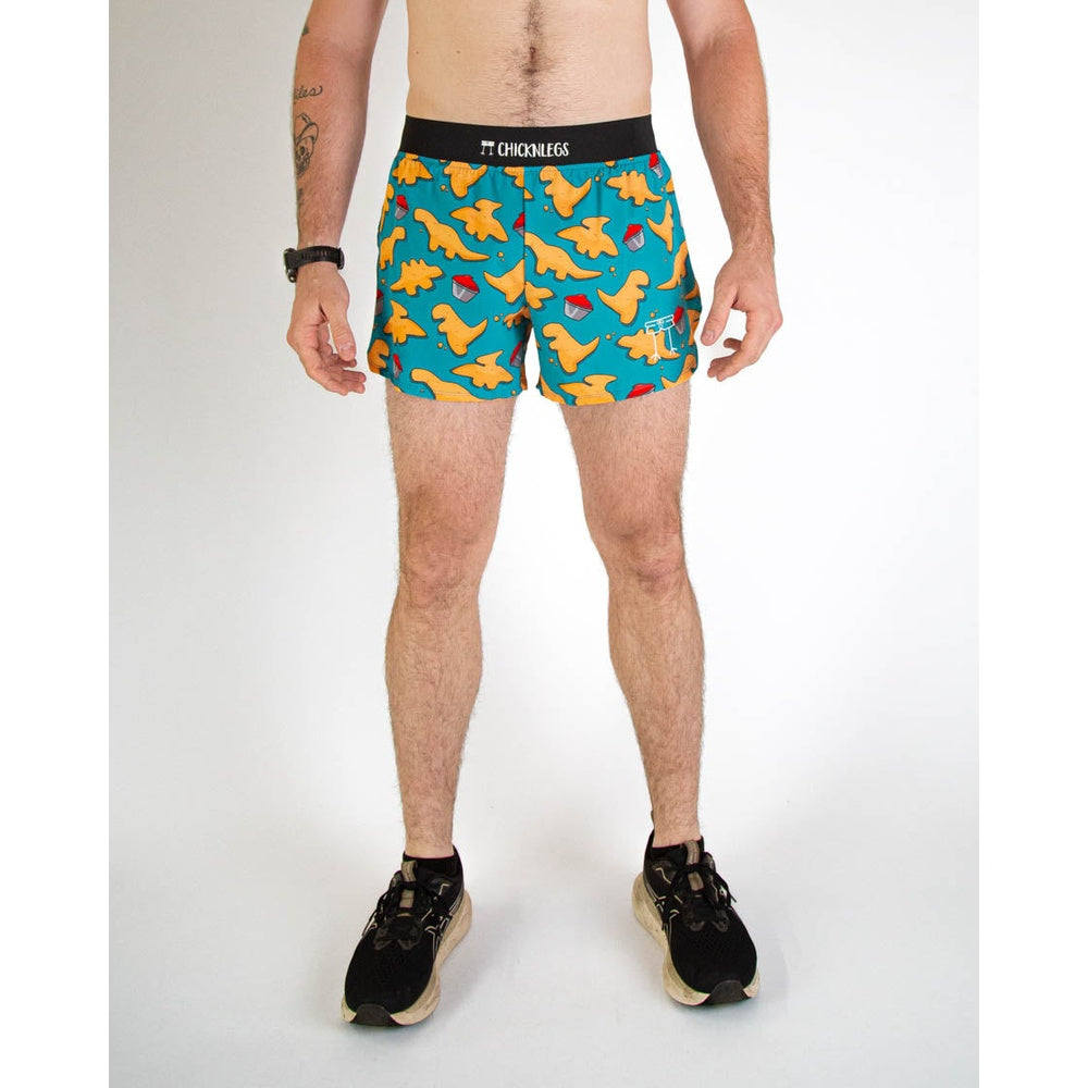 ChicknLegs men's shorts with orange dinosaur print on teal background