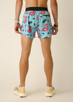 Men's light blue athletic shorts with pink flamingo and tropical leaf print pattern