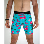 ChicknLegs men's turquoise compression shorts with pink flamingo and tropical leaf pattern