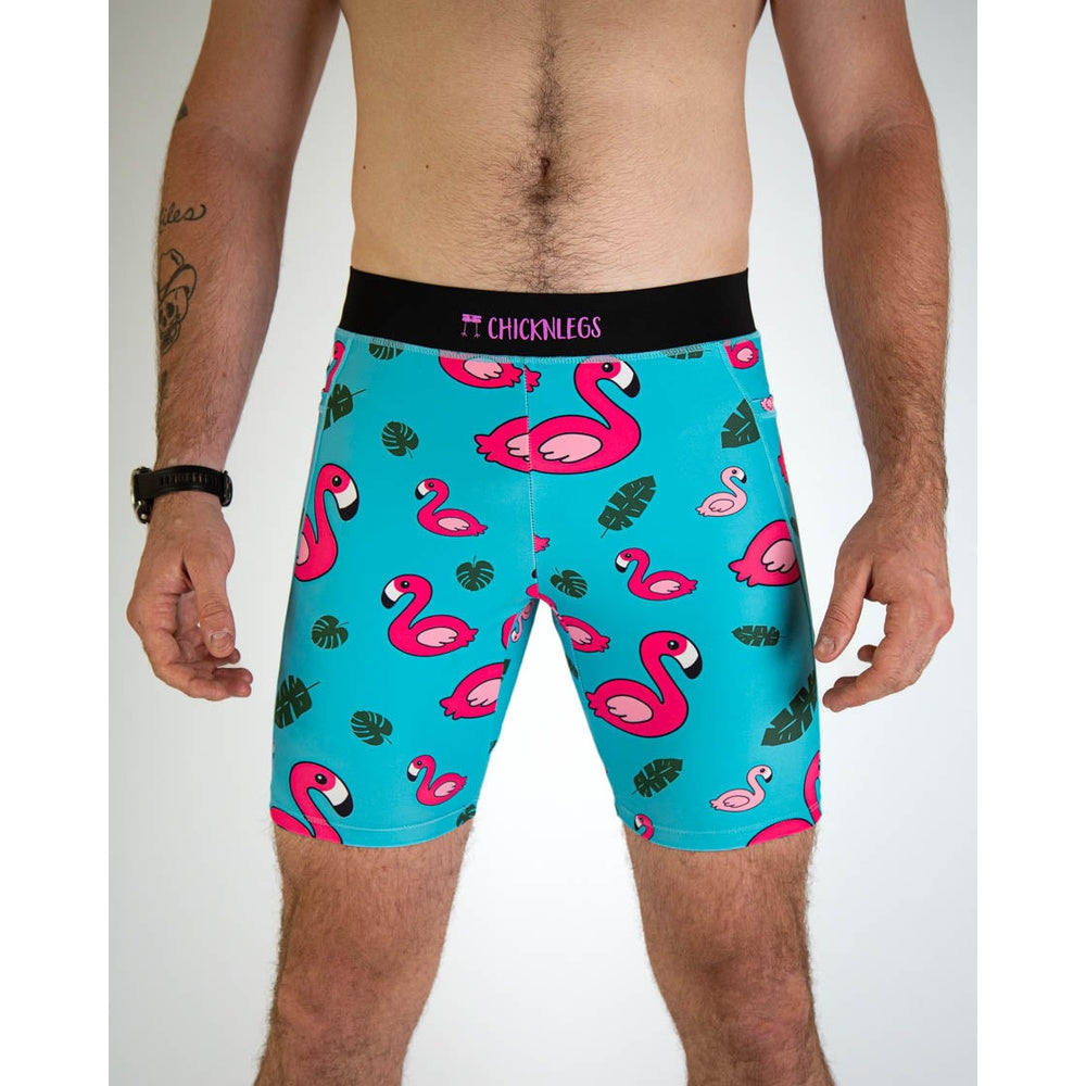 ChicknLegs men's turquoise compression shorts with pink flamingo and tropical leaf pattern