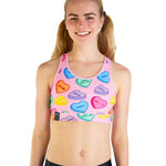 ChicknLegs pink sports bra with colorful conversation heart candy print pattern