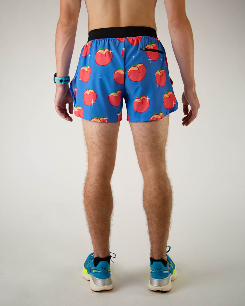 Blue running shorts with red peach pattern worn by male model