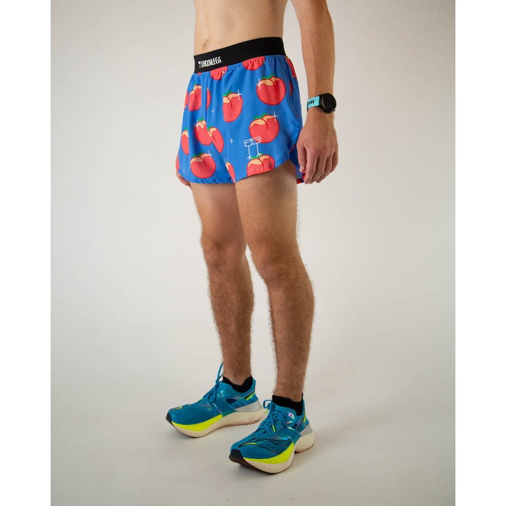 Man wearing blue running shorts with red peach print pattern and split sides