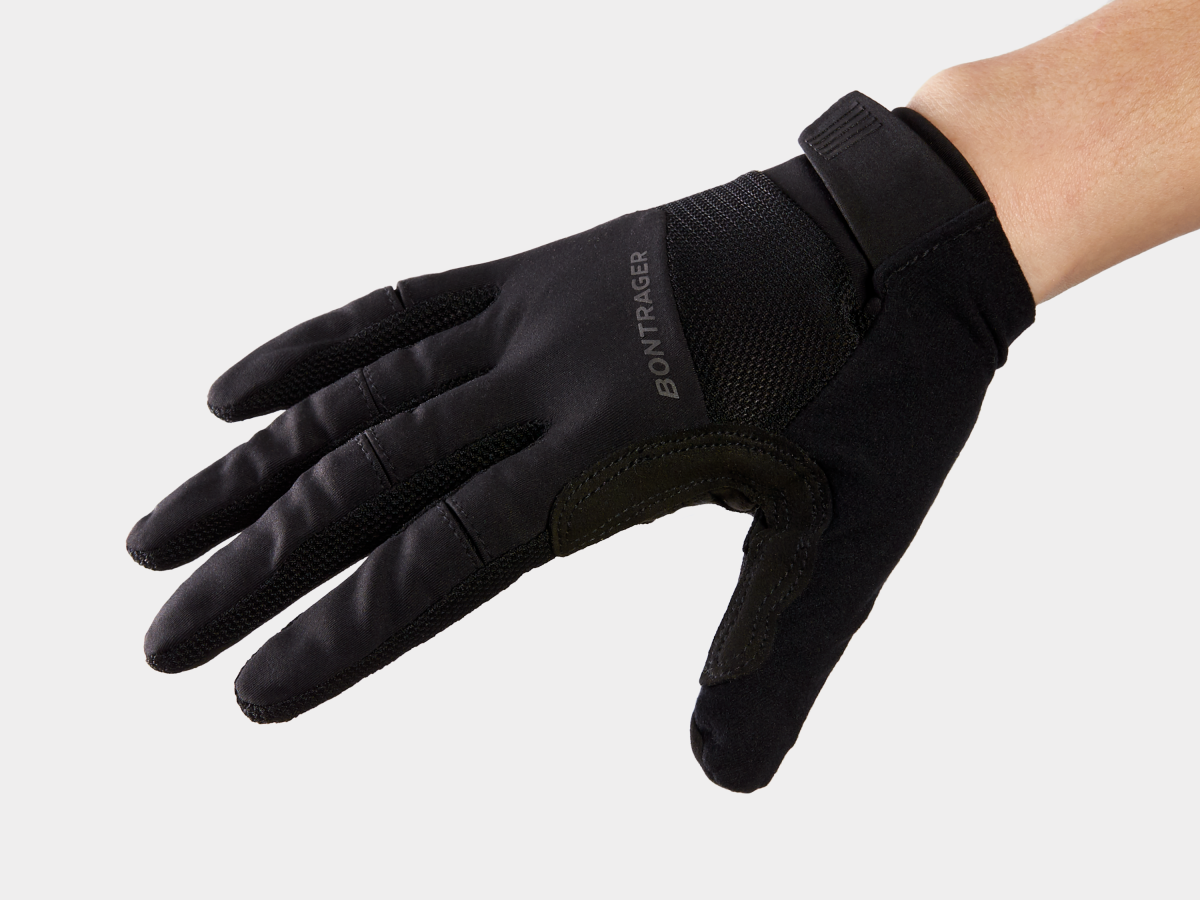 Black Bontrager cycling gloves with mesh panels and velcro wrist closure on hand