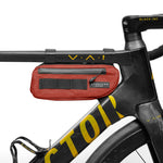 Red Almsthre compact frame bag mounted on black bicycle frame