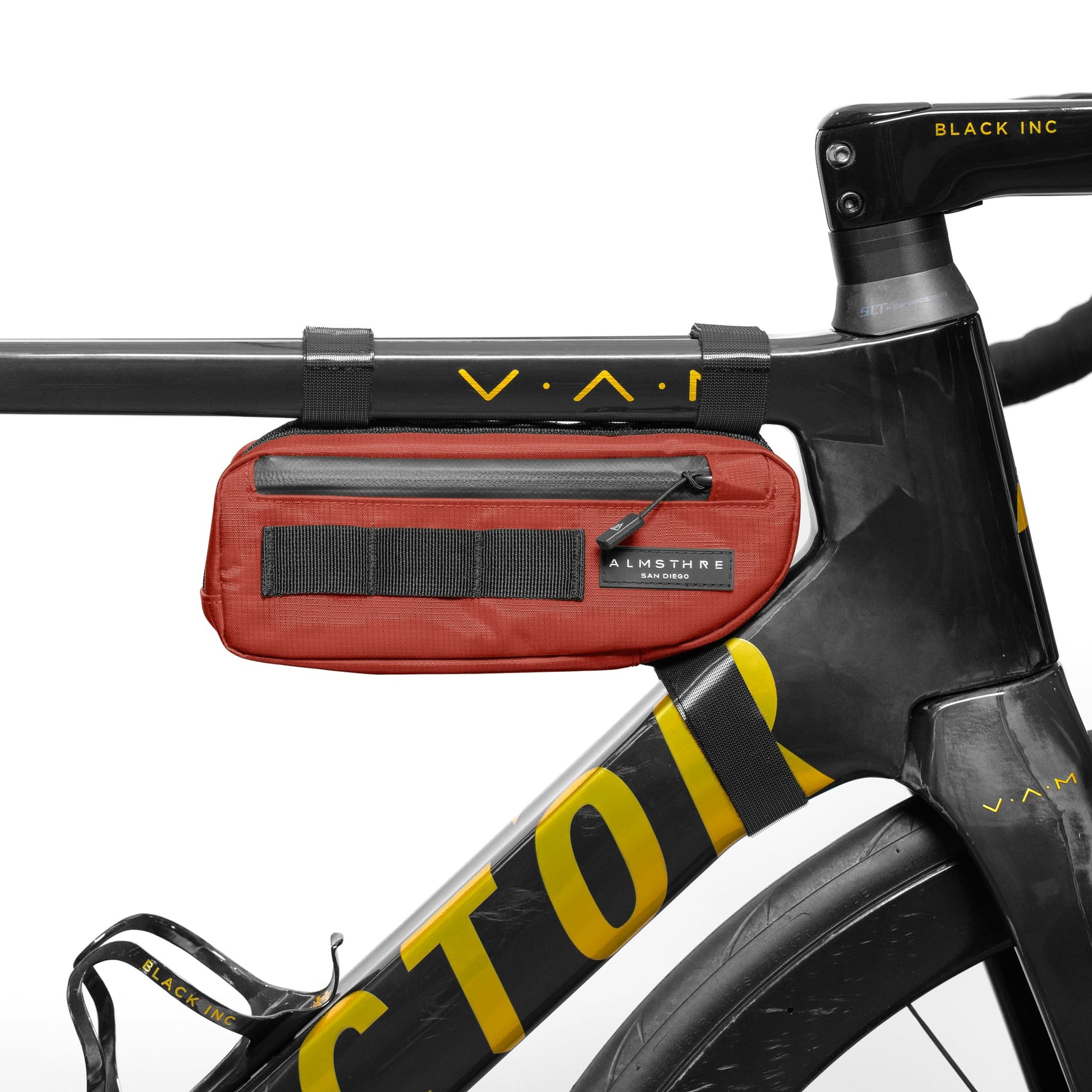 Red Almsthre compact frame bag mounted on black bicycle frame