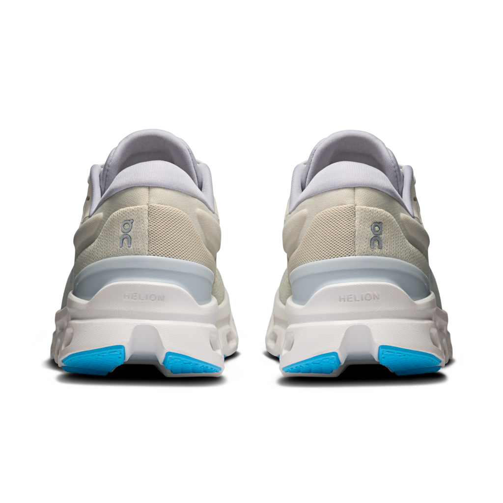 On Cloudstratus 3 women's running shoes in cream colorway with blue sole accents