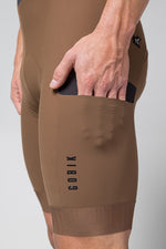 Gobik Grit bib shorts in toffee brown showing side pocket detail