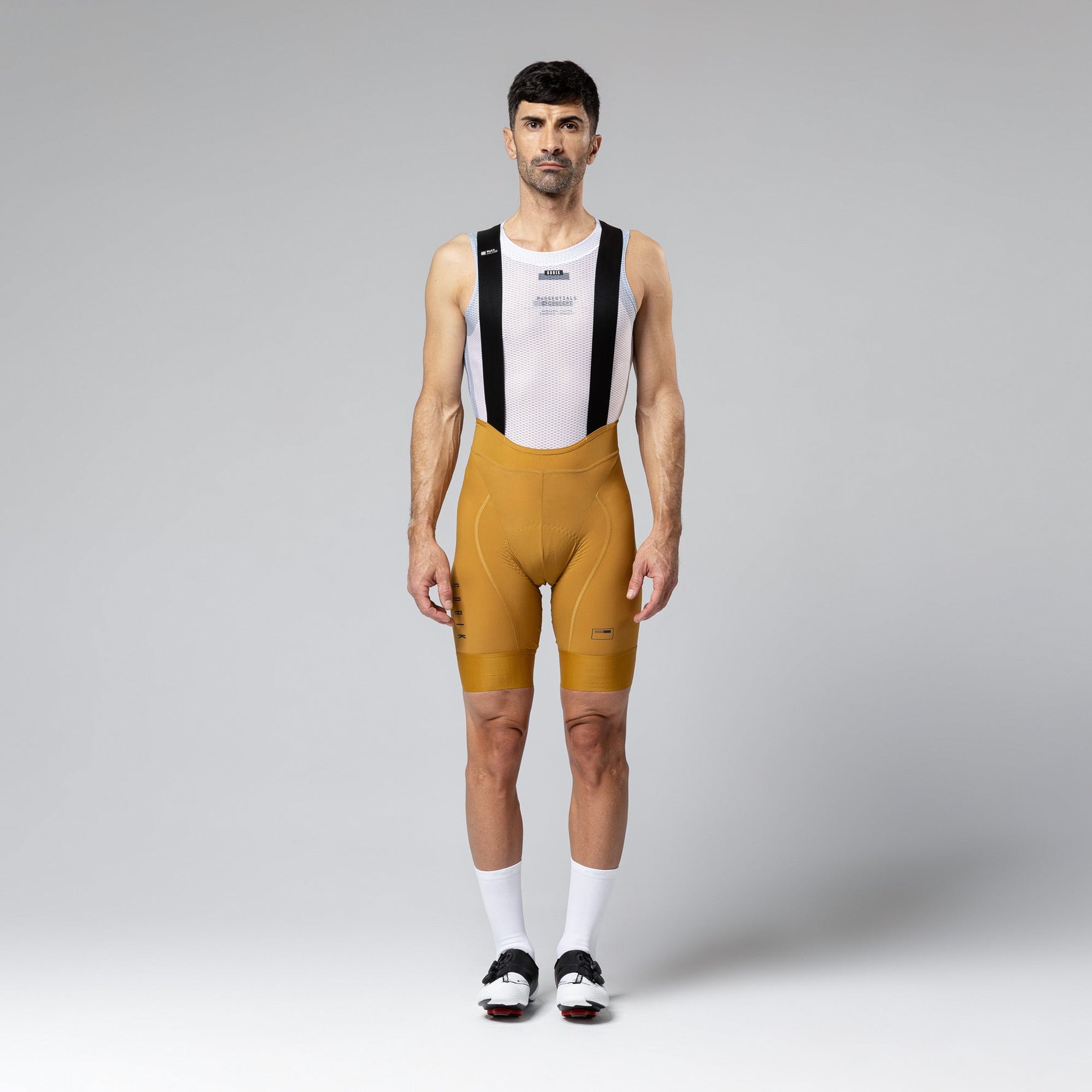 Gobik Matt Compact Men's Bibshort in Turmeric with white mesh base layer