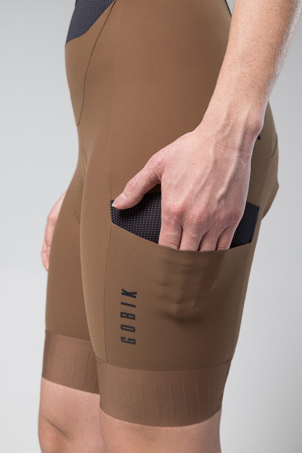 Gobik Grit women's cycling bib shorts in toffee brown with side pocket detail